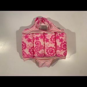 Pink Sunuva baby swimsuit with built-in floaties. Size 1-2.